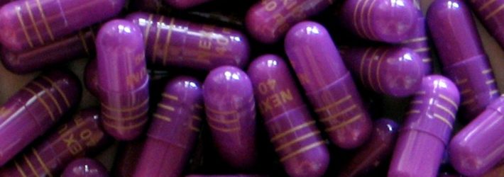 A bunch of purple medication pills